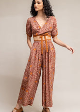 A Model Wearing Brown Upcycled Cotton  Rehno Printed Trousers, curated by Only Ethikal